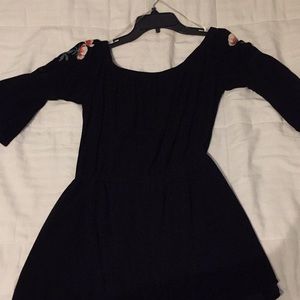 Black romper with flowers on shoulders